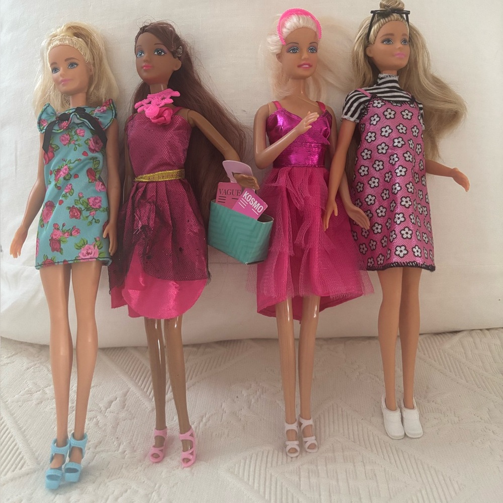 Set of Four Fashion Dolls in Vibrant Dresses